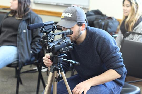 Student working with video camera
